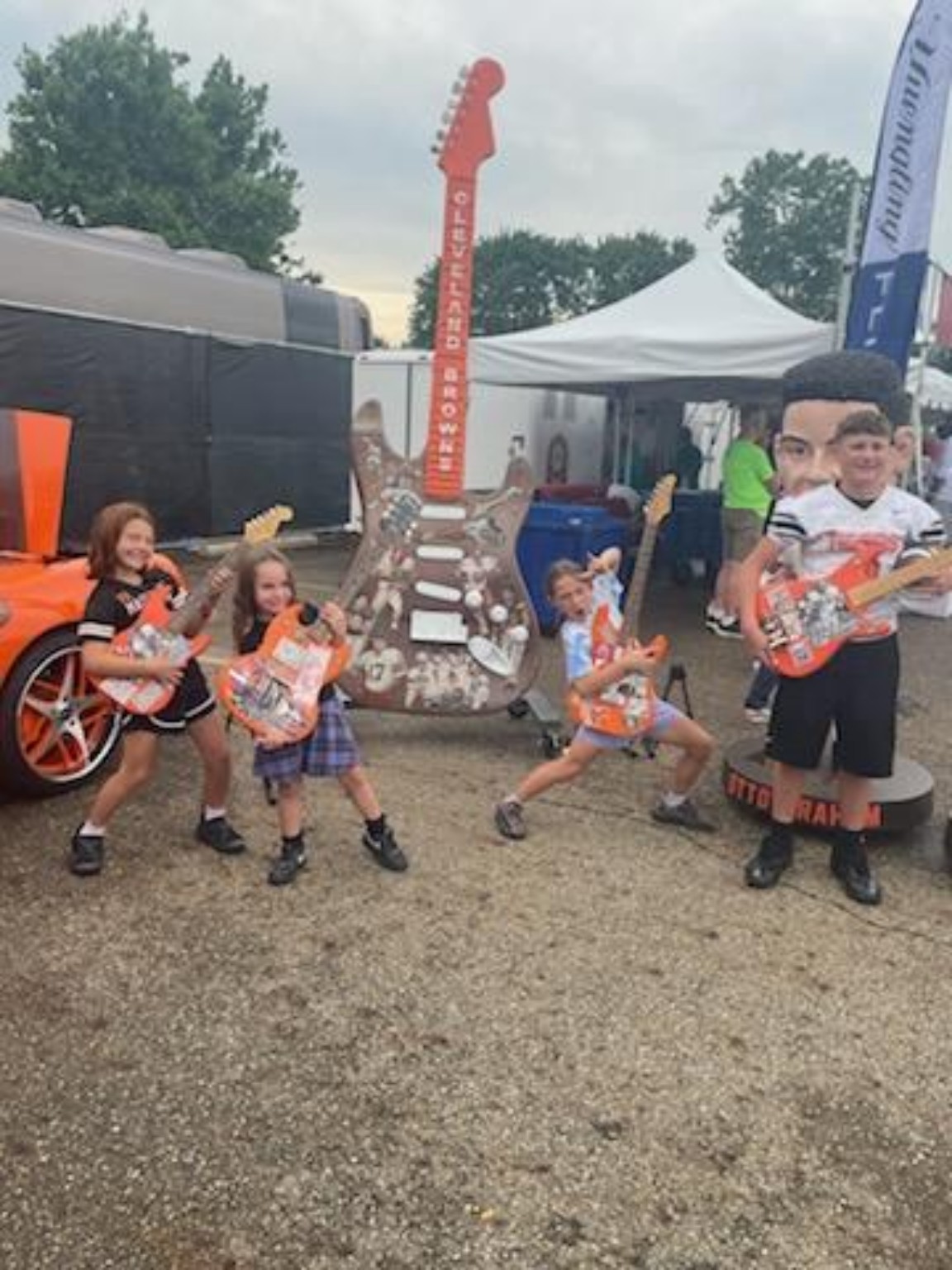 Young fans rocking the tribute guitars at an activation