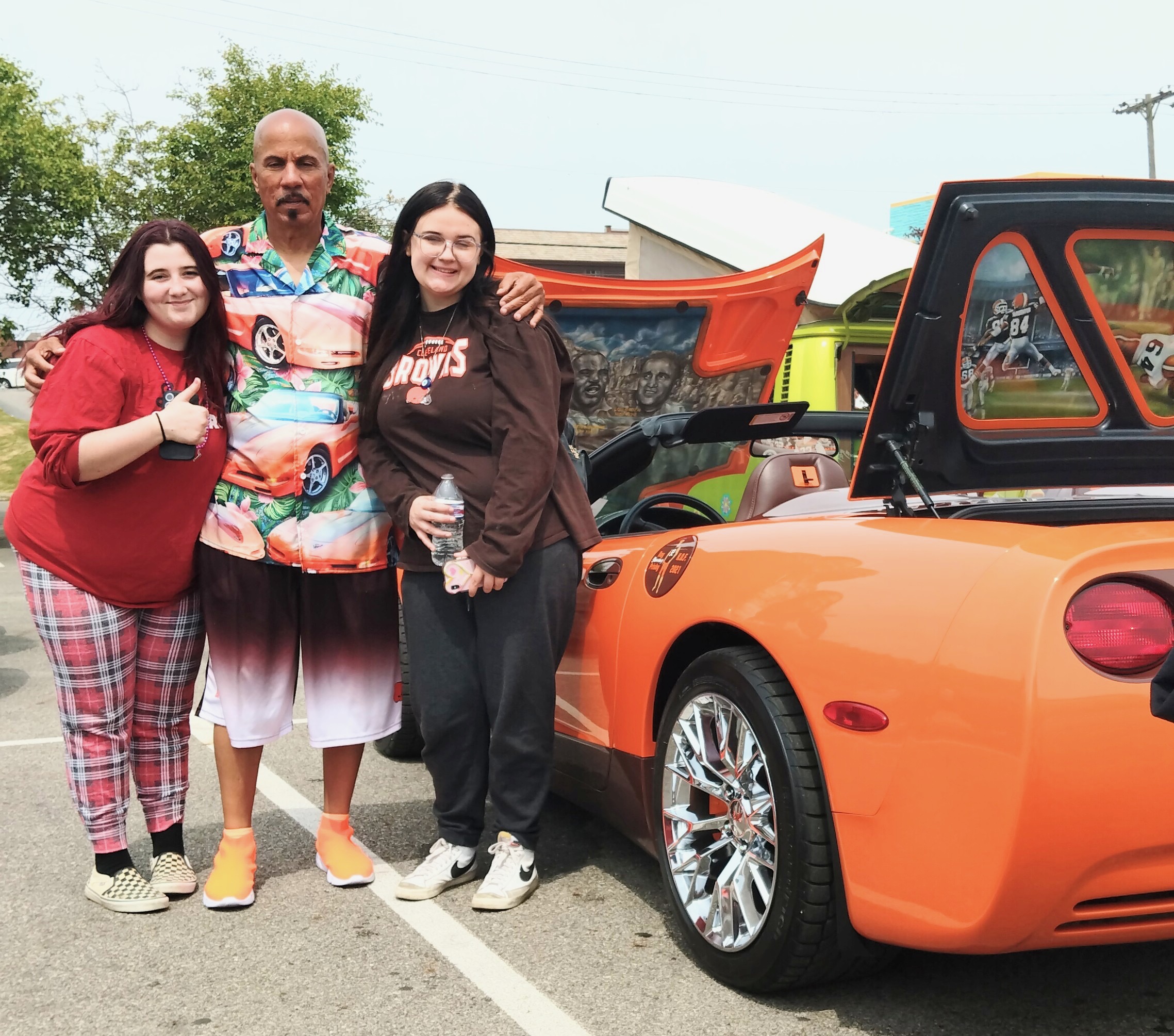 Browns fans beside the Corvette